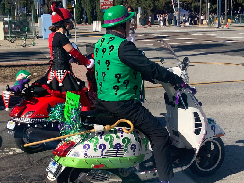 The Riddler and Harley Quinn roll out on some sweet rides.